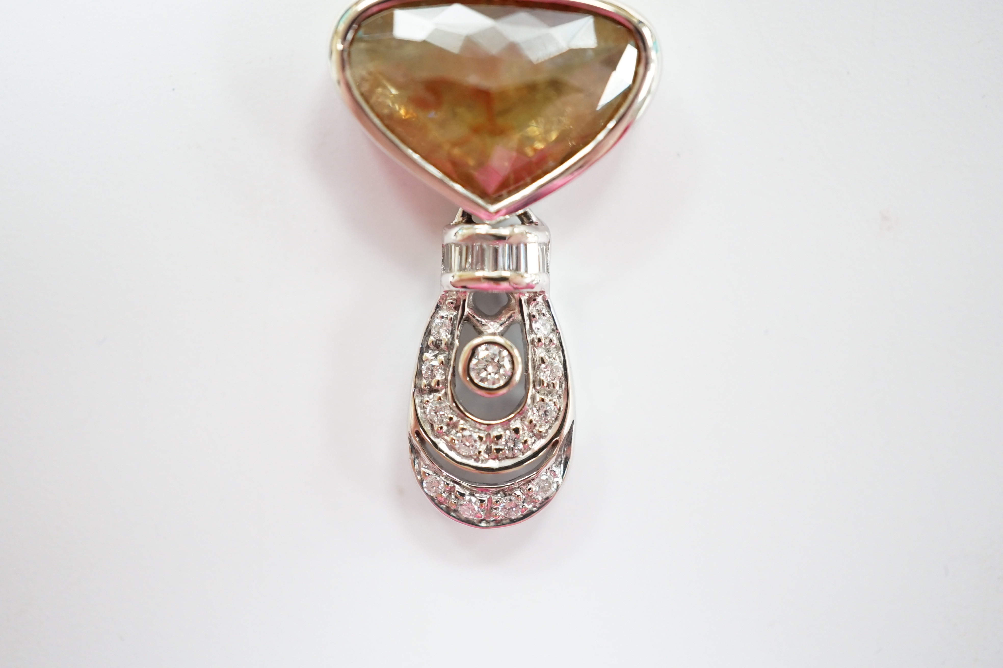A 750 white metal and single stone fancy cut diamond set pendant, with diamond cluster set drop, overall 30mm, gross weight 5 grams.